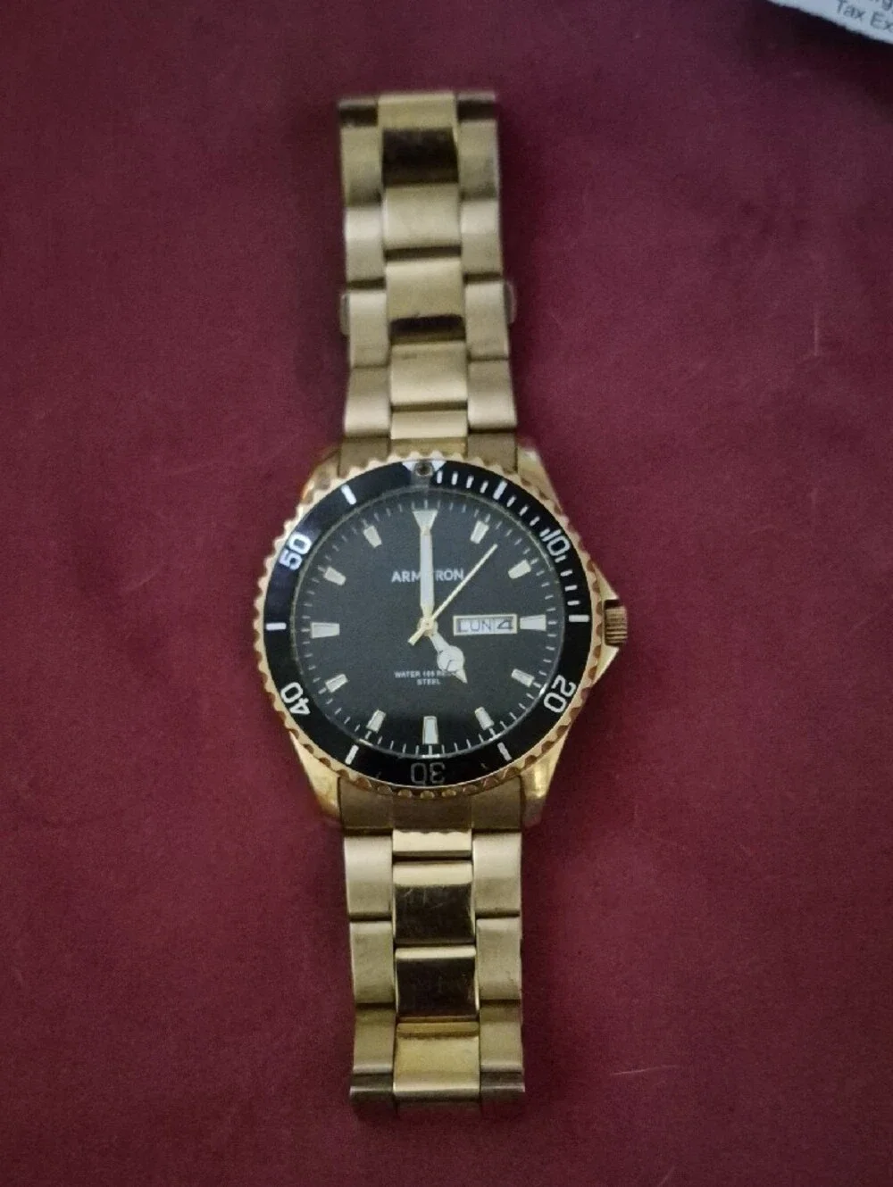 Armitron Gold-Tone Watch with Black Dial and Day-Date